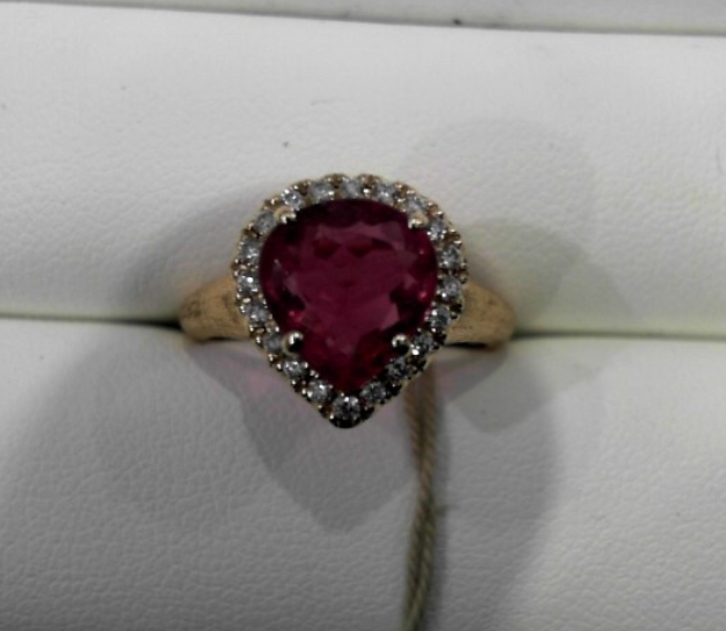 UNICO pear shaped pink tourmaline with 20 round diamonds 18k yellow gold